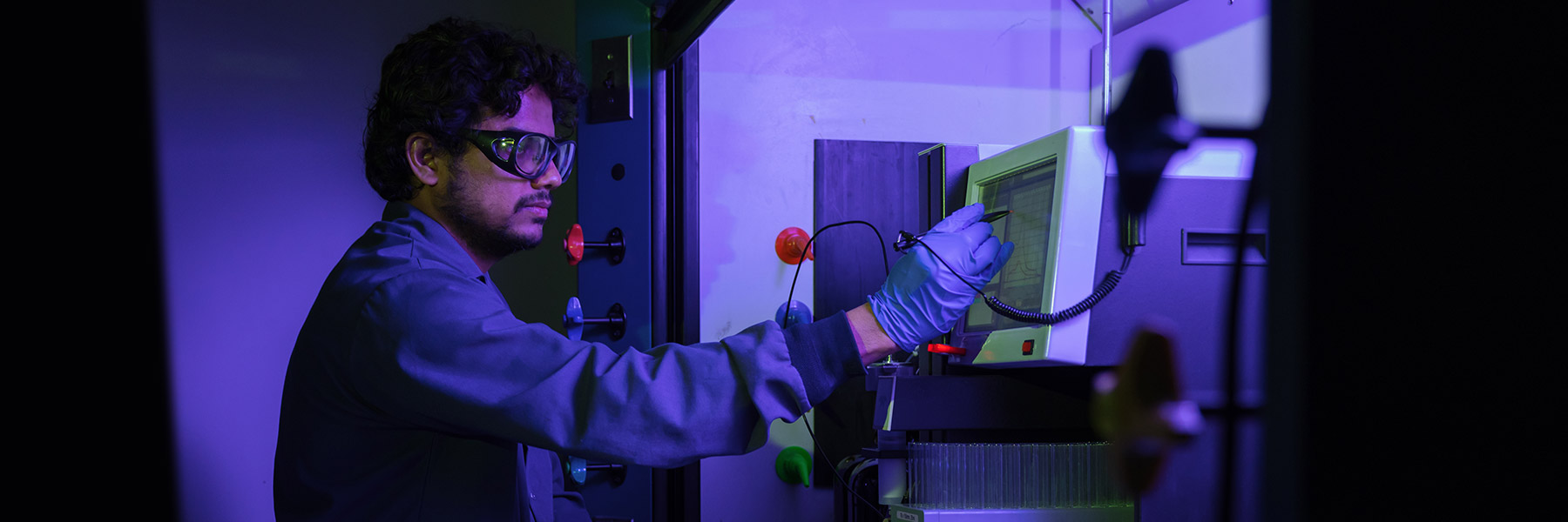 Person working in a laboratory environment.